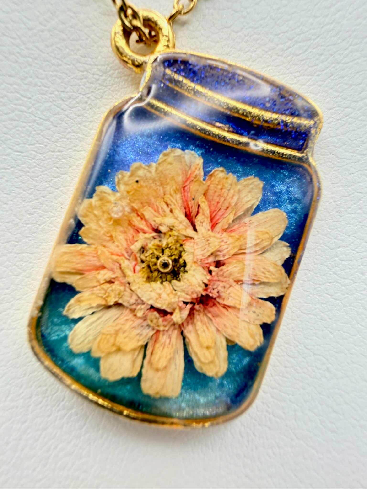 Golden Hour Garden handmade orange and gold bottle-shaped resin necklace